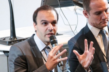 Itay Ingber (left) speaking at Host City 2016, with David Grevemberg CBE (right)