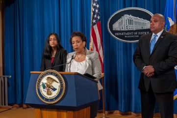 US Attorney General Loretta Lynch, along with Vanita Gupta, head of the Civil Rights Division, and Director Ron Davis of the Community Oriented Policing Services Office photographed in August 2015 (Photo Credit: Lonnie Tague for the Department of Justice)
