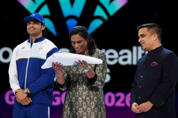 Dr. P. T. Usha, President of the IOA, Gujarat's Hon'ble Deputy Chief Minister Harsh Sanghavi and Neeraj Chopra of Team India accept the Commonwealth Sport flag during the Closing Ceremony Dr. P. T. Usha, President of the IOA, Gujarat's Hon'ble Deputy Chief Minister Harsh Sanghavi and Neeraj Chopra of Team India accept the Commonwealth Sport flag during the Closing Ceremony